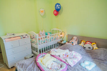 Baby room with crib and bed