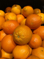 Box of ripe oranges
