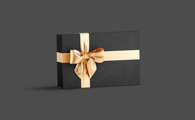 Blank black gift box with gold ribbon bow mockup,