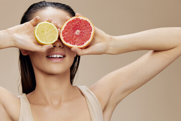 young woman grapefruit with lemon in hands smile vitamins close-up Lifestyle