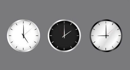 Realistic clock on the wall, black and white. The arrow on the dial shows the time. The set is dark and light. Metal, silver edging.
Vector image.