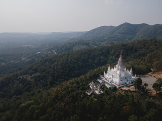 Fototapeta na wymiar Aerial view of white temple at the top of mountain in Chiangmai, Thailand