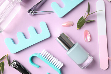 Concept of nail care with manicure accessories on pink background