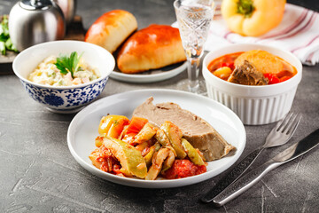 Dinner table with different dishes, three-course set of three courses soup, second course and...