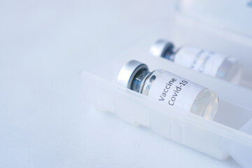 Close up of coronavirus vaccine in a box on white background 