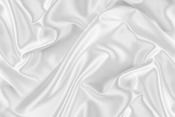 Closeup of rippled white silk fabric. White silk fabric as an abstract background.