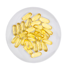 Tas de pilules de capsules d& 39 huile de poisson isolé sur plaque blanche. Vue de dessus.