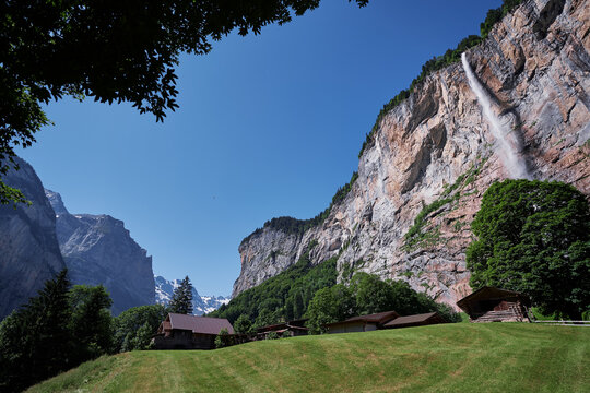 Staubbachfall waterfall in  Lauterbrunnen town. Beautiful swiss village in Alps Mountains.