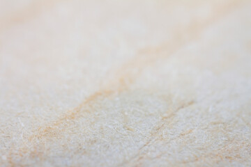 Extreme closeup of biege handmade paper