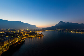 Panoramic shot of Lecco city  and Lake Como at sunrise looking at south. - obrazy, fototapety, plakaty
