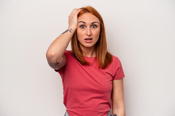 Fototapeta premium Young caucasian woman isolated on white background being shocked, she has remembered important meeting.