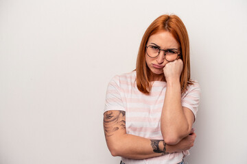 Young caucasian woman isolated on white background who feels sad and pensive, looking at copy space.