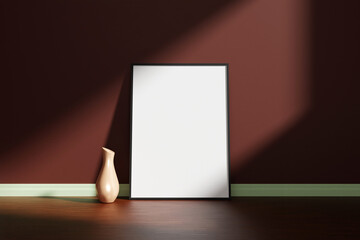 Vertical black poster or photo frame mockup with vase on the wooden floor leaning against the room wall with shadow