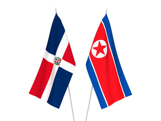 National fabric flags of Dominican Republic and North Korea isolated on white background. 3d rendering illustration.