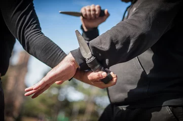 Fotobehang Knife vs knife fight. Kapap instructors demonstrates sombrada drill training © guruXOX