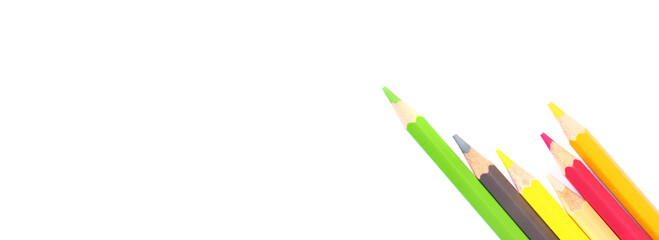 Naklejka premium Colored pencils on white background, copy space