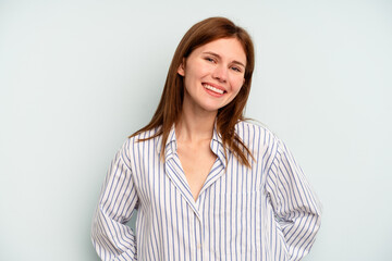 Obraz premium Young English woman isolated on blue background happy, smiling and cheerful.