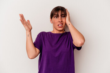 Young Argentinian woman isolated on white background screaming with rage.