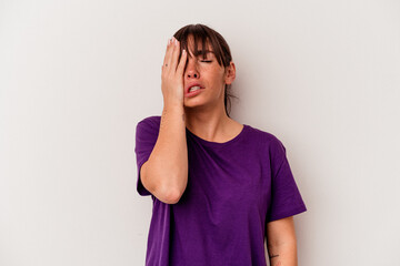 Young Argentinian woman isolated on white background tired and very sleepy keeping hand on head.