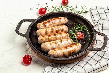 Grilled sausage with spinach, avocado and cherry tomato. hot barbecue dish. Keto paleo diet menu....