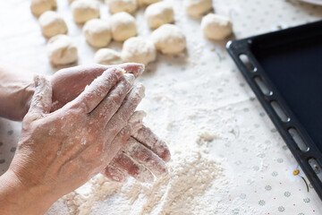 Female hands in the flour. Home baking.