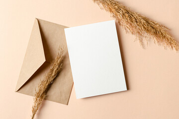 Wedding invitation or greeting card mockup with dry plant decorations