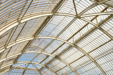 Roof with metal structure and glass of a victorian glasshouse detailed pattern and decoration