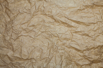 Textured brown paper background.
