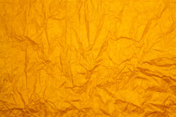 Textured orange paper background.