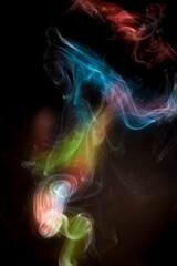 Colorful smoke on black background.