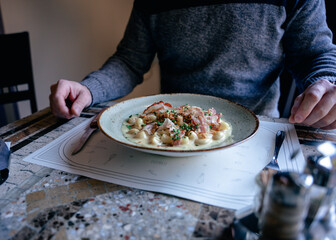 Person with pasta.