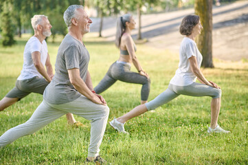 Group of mid aged people having a workout in the park