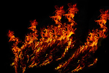 Fototapeta na wymiar The flames raged on the cracked ground.It represents drought and natural disasters.thirst and hunger concept.