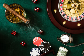 Roulette Wheel, Casino Chips on poker Table. Top Down View
