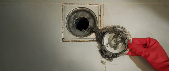 Drain cleaning. Clogged and dirty sewer pipes floor drain. Full of hair and accumulated clogged...
