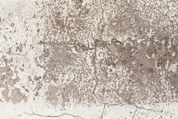 Background from a pattern of gray stone wall covered with decorative plaster.