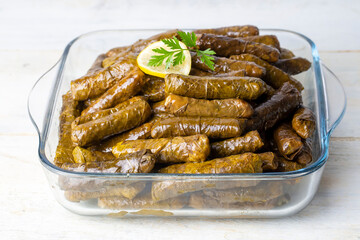 Delicious dolma (sarma) stuffed grape leaves rice,. Lebanese dolma sarma on plate. Lebanon turkish greek middle eastern cuisine. (Turkish name; Yaprak sarma)