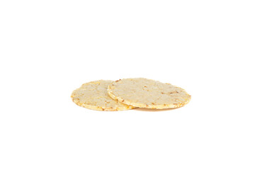 Two thin dry cornbread on a white background.