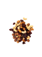 Top view of a mixture of shelled nuts with cranberries on a white background.