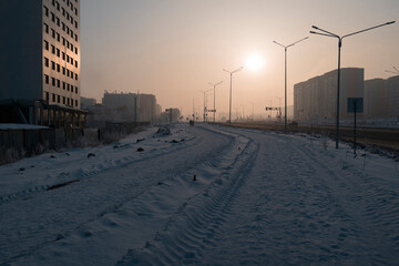 Newly built large avenue. New residential area. Construction site. Buildings under construction. Harsh winter. Ust-Kamenogorsk (kazakhstan)