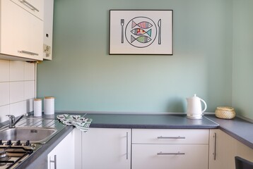 Odnowiona kuchnia i jadalnia w nowoczesnym mieszkaniu - obrazy, fototapety, plakaty