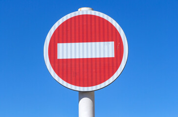 Small-shaped stop sign on a blue background
