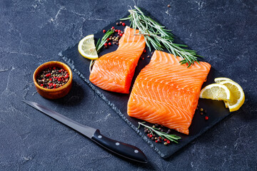Fresh salmon fish fillet on slate plate