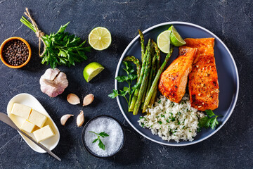 fried salmon fish fillet with rice and asparagus