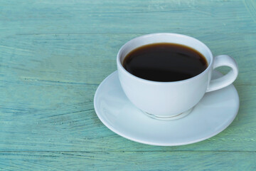 Fototapeta na wymiar White cup of black coffee