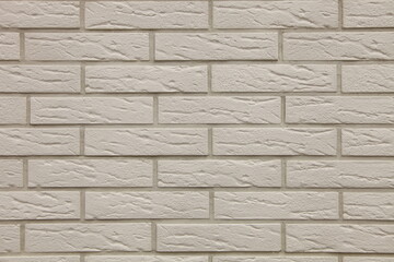 Wall from a white brick with a regular laying      