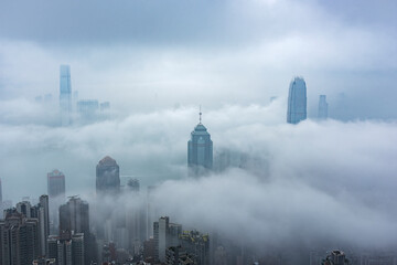 Skyscraper in downtown of Hong Kong city in fog