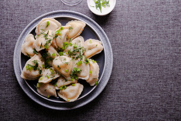 Dumplings with potatoes and sour cream. Vareniki is a dish of Slavic cuisine.