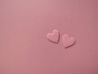 Fototapeta premium Valentine's Day background. Pink hearts on pink background. copy space. Valentines day concept.
