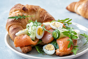 Croissant Sandwich with salmon, cucumber and eggs